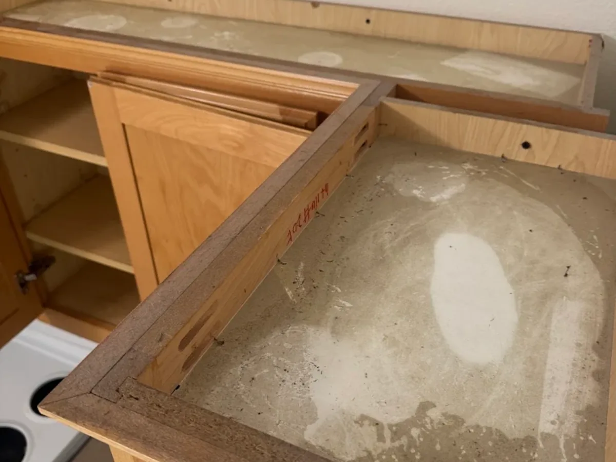 Wood drawer pulled out for interior cabinet cleaning