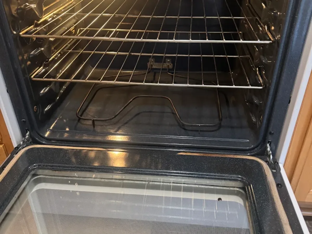 Cleaned oven interior with racks in place